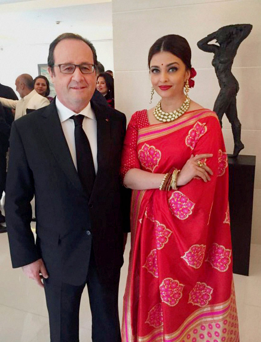French President Francois Hollande with actress Aishwarya Rai Bachchan at a special luncheon in New Delhi, Jan. 27. (PTI Photo | Twitter) 