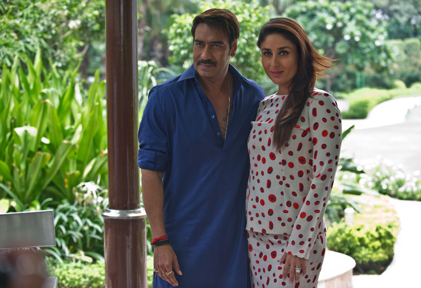 File photo of Ajay Devgn (l) and Kareena Kapoor Khan as they attend a promotional event for "Singham Returns," in New Delhi, Aug. 11, 2014. (Prakash Singh | AFP | Getty Images) 