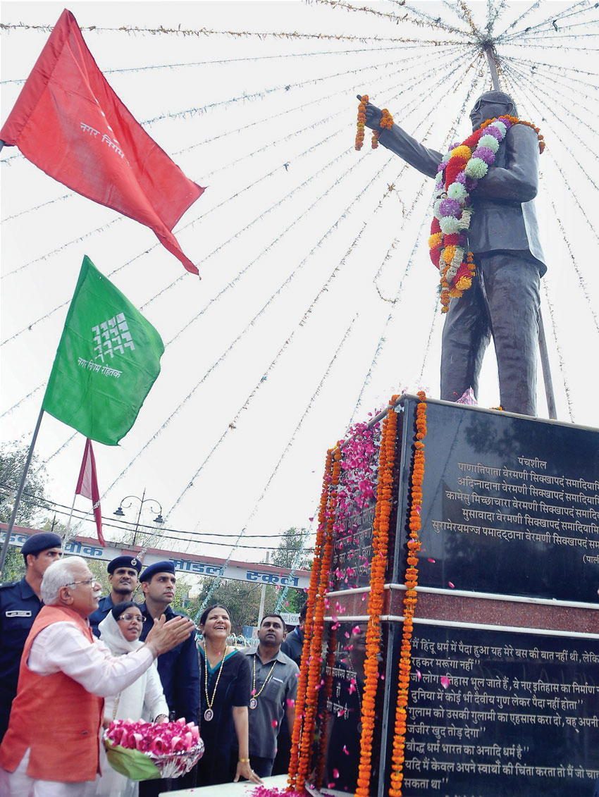 Haryana Chief Minister Manohar Lal Khattar seen here paying tribute to Dr. Bhim Rao Ambedkar on his birth anniversary in Rohtak, April 14. (Press Trust of India) 