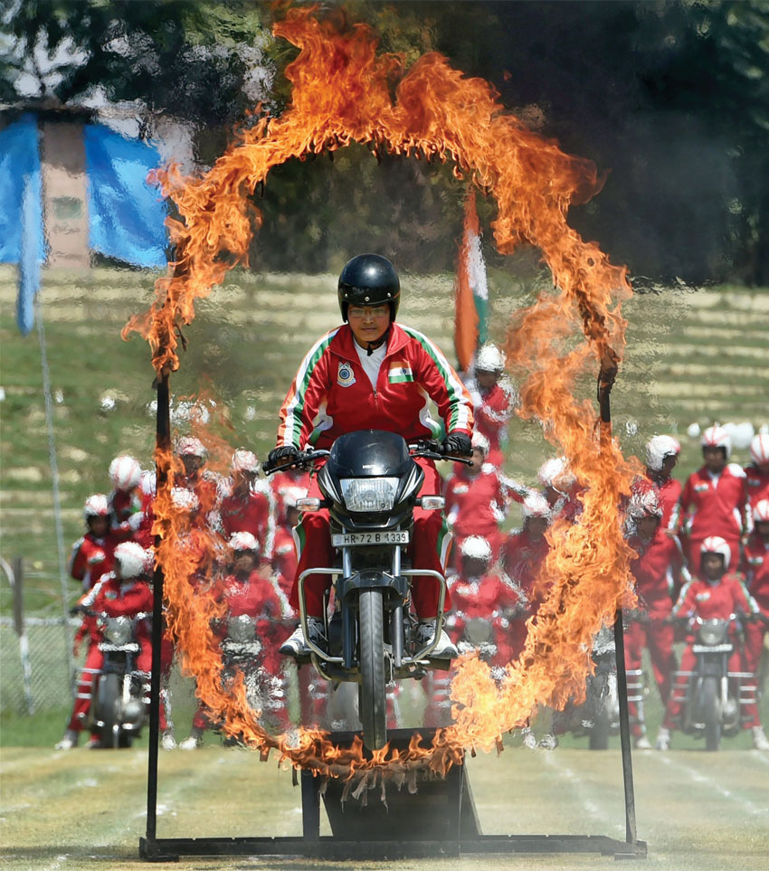 Female daredevils team of CRPF performs stunts during the celebration of 70th Independence day at Bakshi stadium in Srinagar, Aug. 15. (S. Irfan/PTI)