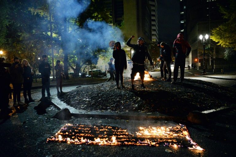 Siliconeer | Portland protesters burn flags on tense US election night