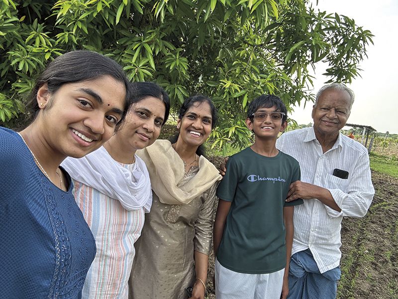 My family taking a picture in front of my mother’s tree. (Sahana Nagadala)