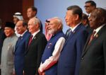 Pagecasi 03 Brics 2026 India H20260913216414 (Above) Indian Prime Minister Narendra Modi (c) with leaders of BRICS member/partner countries at the 18th BRICS Summit, in New Delhi, Sept. 13. (Press Information Bureau)