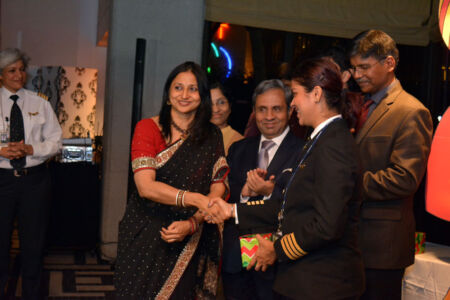 Cupertino Vice Mayor Savita Vaidhyanathan presents a memento to Captain Ramya Kirti Gupta of Air India as Consul General Ambassador Venkatesan Ashok and Sandeep Roy Choudhury look on. page-airindia-womensday-06