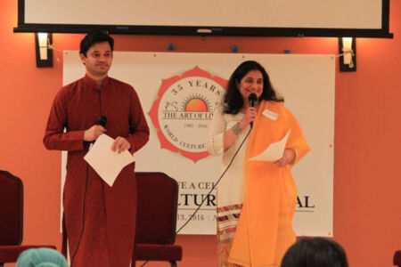 Art of Living and Sri Sri's 35 Year Journey to create a One World Family recited by Satej Chaudhary and Sanjana Chopra of Art of Living. page-aol-wcf-04