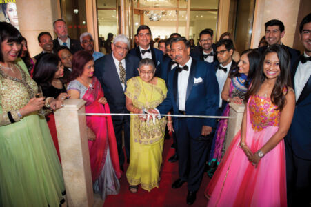 Bhindi family at the Ribbon cutting for the renovated showroom. page-bhindi-07