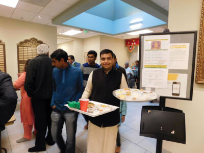 A devotee participating in the “Chhappan Bhog.” page-chhapanbhog-12