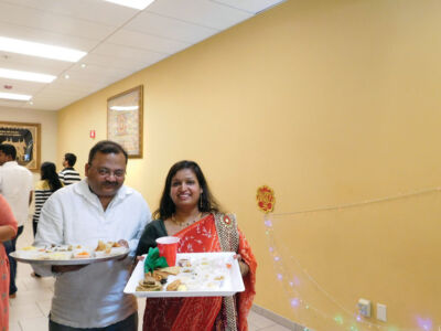 Devoted couple participating in the “Chhappan Bhog.” page-chhapanbhog-13