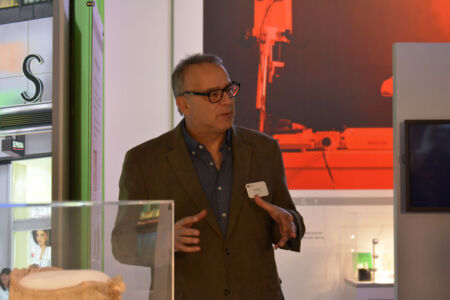 Senior Curator Dag Spcier explains an exhibit at the Computer History Museum. (Amar D. Gupta/Siliconeer) page-computer-08