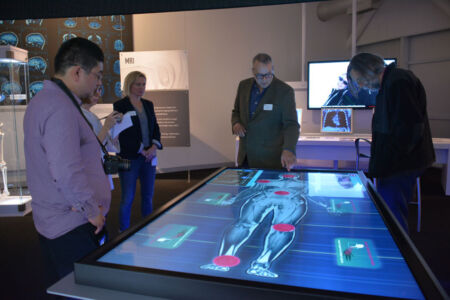 Can you diagnose the patient’s problem? Select a highlighted body part from a life-size full-body MR image on a large multi-user flat screen. Scroll through consecutive images and compare the patient’s MRI with a healthy one. Can you spot the problem by comparing the images? Try to complete all 5 challenges. (Amar D. Gupta/Siliconeer) page-computer-17