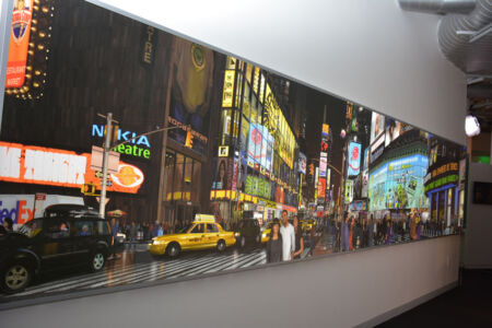 A large wall poster in Photoshop gallery, famed artist Bert Monroy artwork Times Square is 22 feet long and 4 feet high and was created over four years. It contains over 750,000 layers in Photoshop and depicts Times Square with dozens of digital imaging artists and pioneers, including Photoshop creators John and Thomas Knoll, as well as some of Monroy’s family and friends. (Amar D. Gupta/Siliconeer) page-computer-38