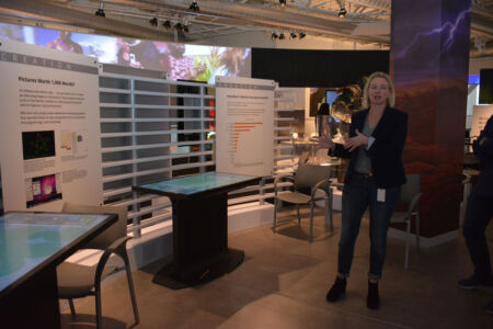 Kirsten Tashev explains the Coding Pond, an interactive touch table with a lily pond environment. Visitors construct simple blocks-based programs to control the actions of colorful frogs that hop around the pond and eat bugs. Each table allows for two players so that visitors can engage in friendly competition. The table introduces several programming concepts including sequential actions, loops and conditional logic. page-computer-51