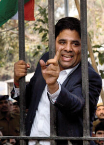 A lawyer shouts slogans standing on the main gate of Patiala House Courts before JNUSU President Kanhaiya Kumar was produced in New Delhi, Feb. 17. (Press Trust of India) page-cover-jnu-02