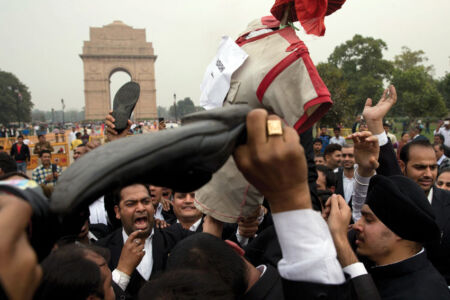 Lawyers shout slogans during a protest march in New Delhi, Feb. 19. The protest march was held to demand action against those indulging in anti-national activities. (Press Trust of India) page-cover-jnu-08