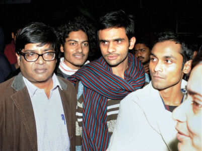 Jawaharlal Nehru University students Umar Khalid (c) and Anirban Bhattacharya (r) who are facing charges of sedition, come out of JNU campus to surrender before the police in New Delhi, Feb. 23. (Press Trust of India) page-cover-jnu-14