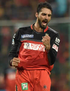 Royal Challengers Bangalore's S. Aravind celebrate the wicket of David Warner of SRH during the IPL 2016 Final match between Royal Challengers Bangalore and Sunrisers Hyderabad at Chinnaswamy Stadium in Bengaluru, May 29. (Shailendra Bhojak | PTI) page-cricket-ipl9-04