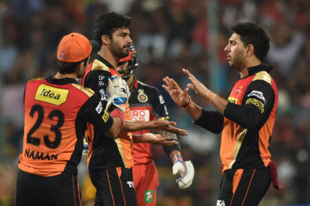 Sunrisers Hyderabad Barinder Sran celebrates with teammates after taking the wicket of Virat Kohli during the IPL 2016 Final match between Royal Challengers Bangalore and Sunrisers Hyderabad at Chinnaswamy Stadium in Bengaluru, May 29. (Shailendra Bhojak | PTI) page-cricket-ipl9-09