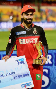 Royal Challengers Bangalore's Skipper Virat Kohli poses with the Most Valuable Player trophy during the award ceremony of the IPL 2016 Final match at Chinnaswamy Stadium in Bengaluru. (Shailendra Bhojak | PTI) page-cricket-ipl9-15