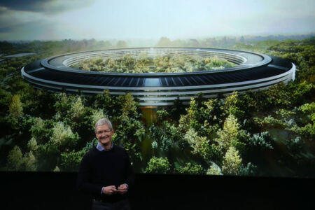 A picture of Apple’s upcoming Spaceship campus shows in the background, as CEO Tim Cook released new products during the March 2016 Apple Special Event in Cupertino, Calif. (John Sullivan | Getty Images) page-cupertino-02-gettyimages