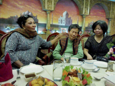 An Indian woman from Chennai, Jennifer An consoling her step sister from China An Roesai (81) as they united in Beijing, May 13, after about 75 years after their father left for India and settled in Chennai where he remarried a local woman. Jennifer came along with her husband V.R.S. Balaji to search for Roesai on the sideline of Prime Minister Narendra Modi's visit to China. (Press Trust of India) page-may21-modi-11-china