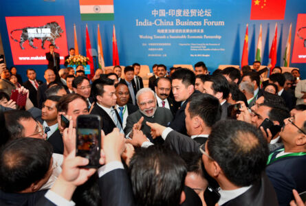 Prime Minister Narendra Modi shaking hands with business leaders at the India-China Business Forum in Shanghai, May 16. (Shahbaz Khan | PTI) page-may21-modi-13-china