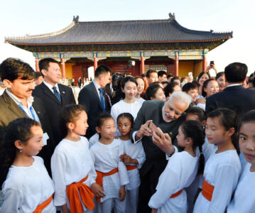 Prime Minister Narendra Modi interacts with children at Yoga-Taichi joint event at the Temple of Heaven in Beijing, May 15. (Shahbaz Khan | PTI) page-may21-modi-14-china