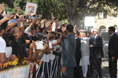 Prime Minister Modi interacts with the huge crowd gathered outside Fairmont Hotel in San Jose, Calif., Sept. 26. page-modi-06