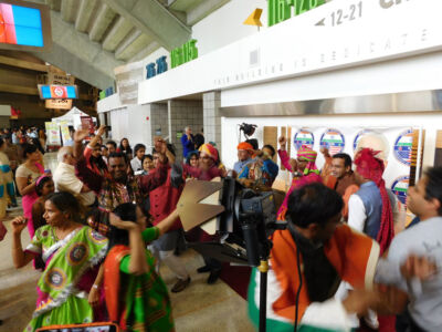 Supporters in a festive mood, ready to greet Prime Minister Modi at the SAP Center, Sept. 27. (Vansh A. Gupta | Siliconeer) page-modi-22-vag
