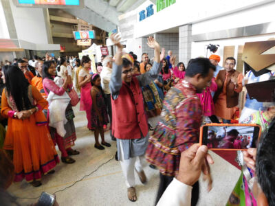 Supporters in a festive mood, ready to greet Prime Minister Modi at the SAP Center, Sept. 27. (Vansh A. Gupta | Siliconeer) page-modi-23-vag