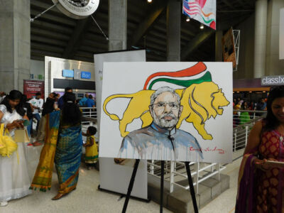 A painting of Prime Minister Narendra Modi with the Make in India lion in the background by Bay Area artist Ramesh Chindam. Many such paintings were on display at the SAP Center, Sept. 27. (Vansh A. Gupta | Siliconeer) page-modi-25-vag