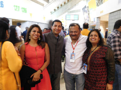(R-l): Siliconeer co-publisher Seema Gupta, Siliconeer editor Amar D. Gupta, Kislay Banka and Sonal Banka in a festive mood, ready to greet Prime Minister Modi at the SAP Center, Sept. 27. (Vansh A. Gupta | Siliconeer) page-modi-43-siliconeer