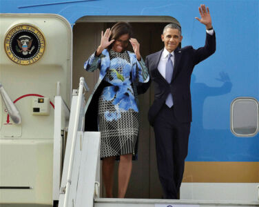U.S. President Barack Obama and First Lady Michelle Obama wave upon their arrival at Air Force station Palam, in New Delhi, Jan. 25. (Kamal Kishore | PTI) page-modi-obama-03