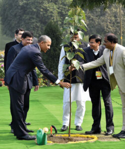 President Barack Obama planting a “Peepal” sapling after paying tribute at Mahatma Gandhi's memorial Rajghat in New Delhi, Jan. 25. (Kamal Singh | PTI) page-modi-obama-14