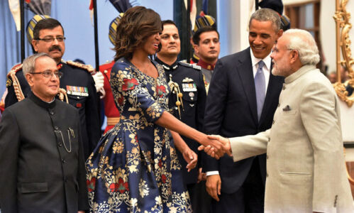 Indian President Pranab Mukherjee and President Barack Obama look on as Prime Minister Narendra Modi shakes hands with First Lady Michelle Obama during a banquet hosted at Rashtrapati Bhavan in New Delhi, Jan. 25. (Vijay Verma | PTI) page-modi-obama-26
