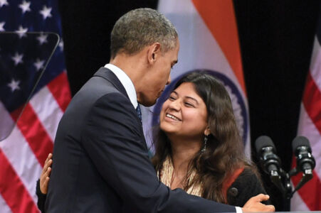 President Barack Obama being welcomed by a consultant of an NGO before addressing a function at Siri Fort Auditorium in New Delhi, Jan. 27. (Subhav Shukla | PTI) page-modi-obama-34