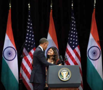 President Barack Obama being welcomed by Neha Buch, an NGO consultant before addressing a function at Siri Fort Auditorium in New Delhi, Jan. 27. (Subhav Shukla | PTI) page-modi-obama-35