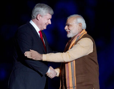 Prime Minister Narendra Modi greets his Canadian counterpart Stephen Harper during the Indian Diaspora event at Ricoh Coliseum in Toronto, Apr. 15. (Press Trust of India) page-modi-toronto-09-inside