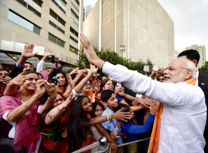 Prime Minister Narendra Modi waves while meeting with the members of Indian community in Mexico City, June 8. (Kamal Kishore | PTI) page-modi-us-11