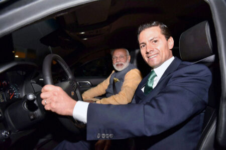 Mexican President Enrique Pena Nieto drives Prime Minister Narendra Modi to a restaurant for Mexican vegetarian fare in Mexico City, June 8. (Press Trust of India) page-modi-us-12
