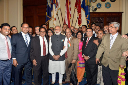 Prime Minister Narendra Modi in a group photograph with the people of Indian community at a community reception event, in Washington, D.C., June 8. (Press Trust of India) page-modi-us-14