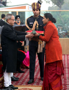 President Pranab Mukherjee giving away the highest gallantry award, Ashok Chakra, to Major Mukund Varadarajan 44th Battalion Rashtriya Rifles/The Rajput Regiment (Posthumous), the award received by his wife, in New Delhi, Jan. 26. (Press Information Bureau) page-repday04-pib-l2015012661598