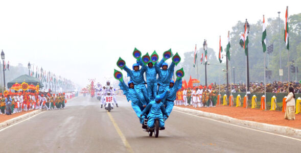 Rajpath comes alive with the dare devil stunts of motorbike riders of Border Security Force, during the 66th Republic Day Parade, in New Delhi, Jan. 26. (Press Information Bureau) page-repday06-pib-l2015012661631