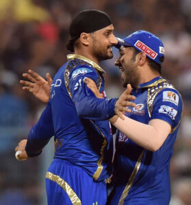 Mumbai Indians captain Rohit Sharma and Harbhajan Singh celebrate the wicket of Chennai Super Kings batsman D. Smith during the IPL Final match at Eden Gardens in Kolkata, May 24. (Ashok Bhaumik | PTI) page-sports-cricket-2015iplchamps-06
