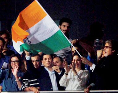 Amitabh Bachchan (r), Sachin Tendulkar with his wife Anjali, industrialist Mukesh Ambani and his wife Nita Ambani and others celebrate India’s victory over Pakistan at Eden Gardens in Kolkata, Mar. 19. (Press Trust of India) page-sports-cricket-wt20-indiapak-01-inside