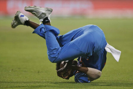 India's Hardik Pandya takes a catch to dismiss Pakistan batsman Sharjeel Khan during the ICC T20 World cup match against Pakistan at Eden Gardens in Kolkata, Mar. 19. (Press Trust of India) page-sports-cricket-wt20-indiapak-05