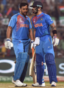 Indian skipper M.S. Dhoni and Virat Kohli discuss strategy during the ICC T20 World cup match against Pakistan at Eden Gardens in Kolkata, Mar. 19. (Ashok Bhaumik | PTI) page-sports-cricket-wt20-indiapak-10
