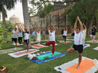 Yoga guru Ajay Gupta (2nd from r) performs yoga exercises along with other practitioners at Lodhi Garden to mark the 2nd International Yoga Day in New Delhi, June 21. (Press Trust of India) page-yoga-07
