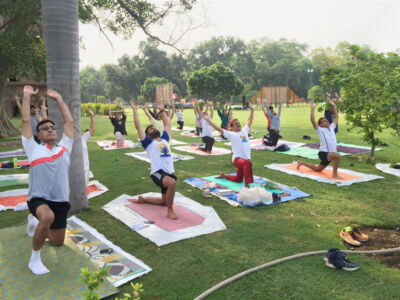 Yoga guru Ajay Gupta (2nd from r) performs yoga exercises along with other practitioners at Lodhi Garden to mark the 2nd International Yoga Day in New Delhi, June 21. (Press Trust of India) page-yoga-08
