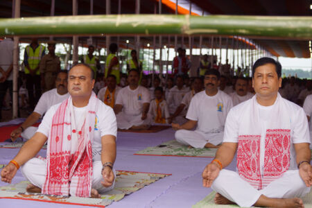Yoga guru Ajay Gupta (2nd from r) performs yoga exercises along with other practitioners at Lodhi Garden to mark the 2nd International Yoga Day in New Delhi, June 21. (Press Trust of India) page-yoga-09