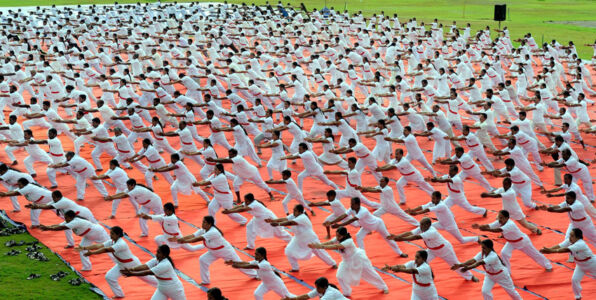 People participate in a mega yoga event conducted by an NGO on International Day of Yoga at Thalassery in Kannur, Kerala, June 21. (Press Trust of India) page-yoga-10